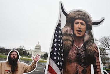 An effigy of Facebook CEO, Mark Zuckerberg (R), dressed as a January 6, 2021, insurrectionist is pla...