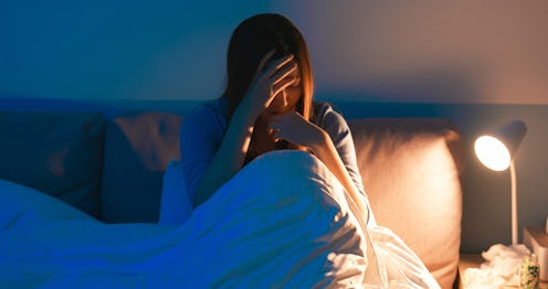 asian woman feel depressed in the bedroom at home