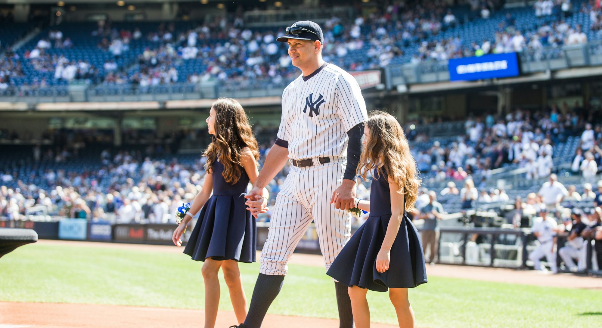 NEW YORK - SEPTEMBER 13: Alex Rodriguez #13 of the New York Yankees enters the field with daughters ...