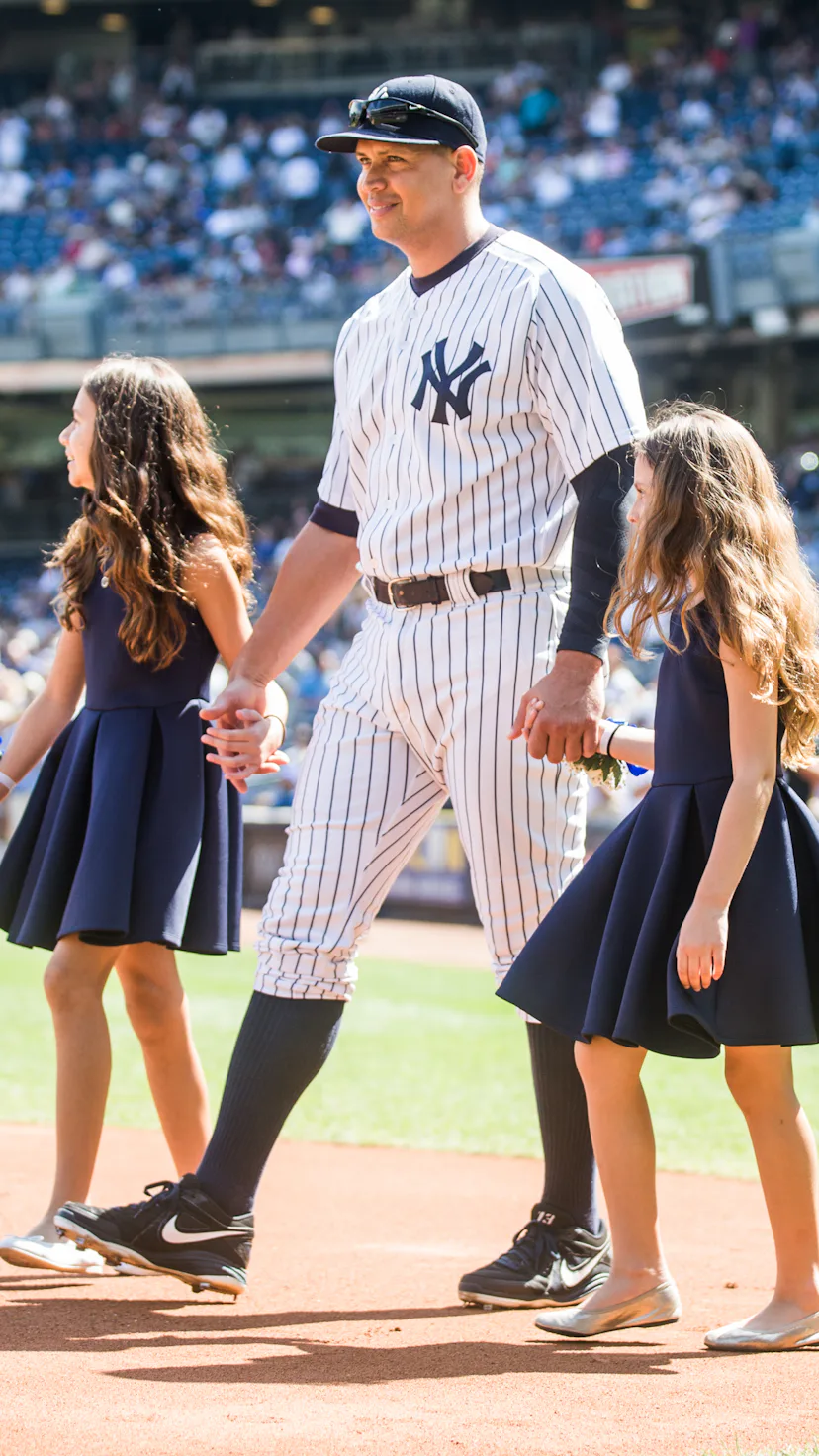 NEW YORK - SEPTEMBER 13: Alex Rodriguez #13 of the New York Yankees enters the field with daughters ...