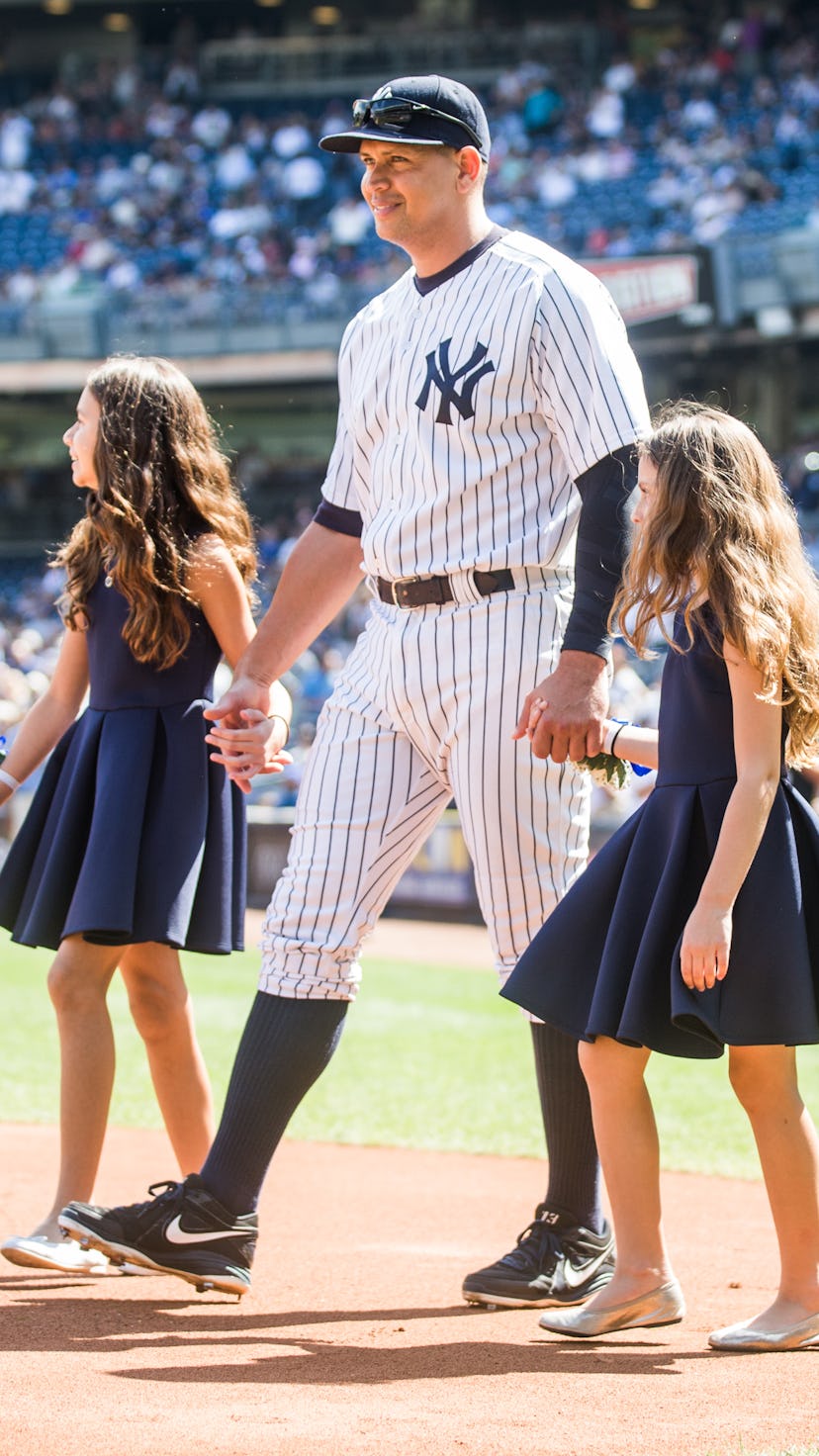 NEW YORK - SEPTEMBER 13: Alex Rodriguez #13 of the New York Yankees enters the field with daughters ...