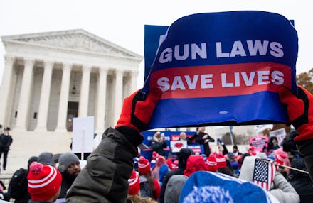Supporters of gun control and firearm safety measures hold a protest rally outside the US Supreme Co...