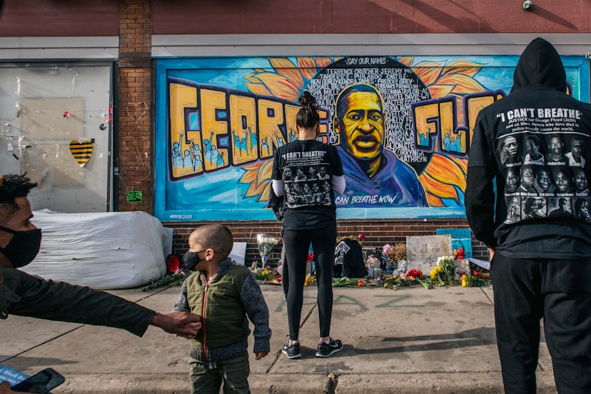 MINNEAPOLIS, MN - APRIL 20: People pay their respects at the mural of George Floyd at the intersecti...