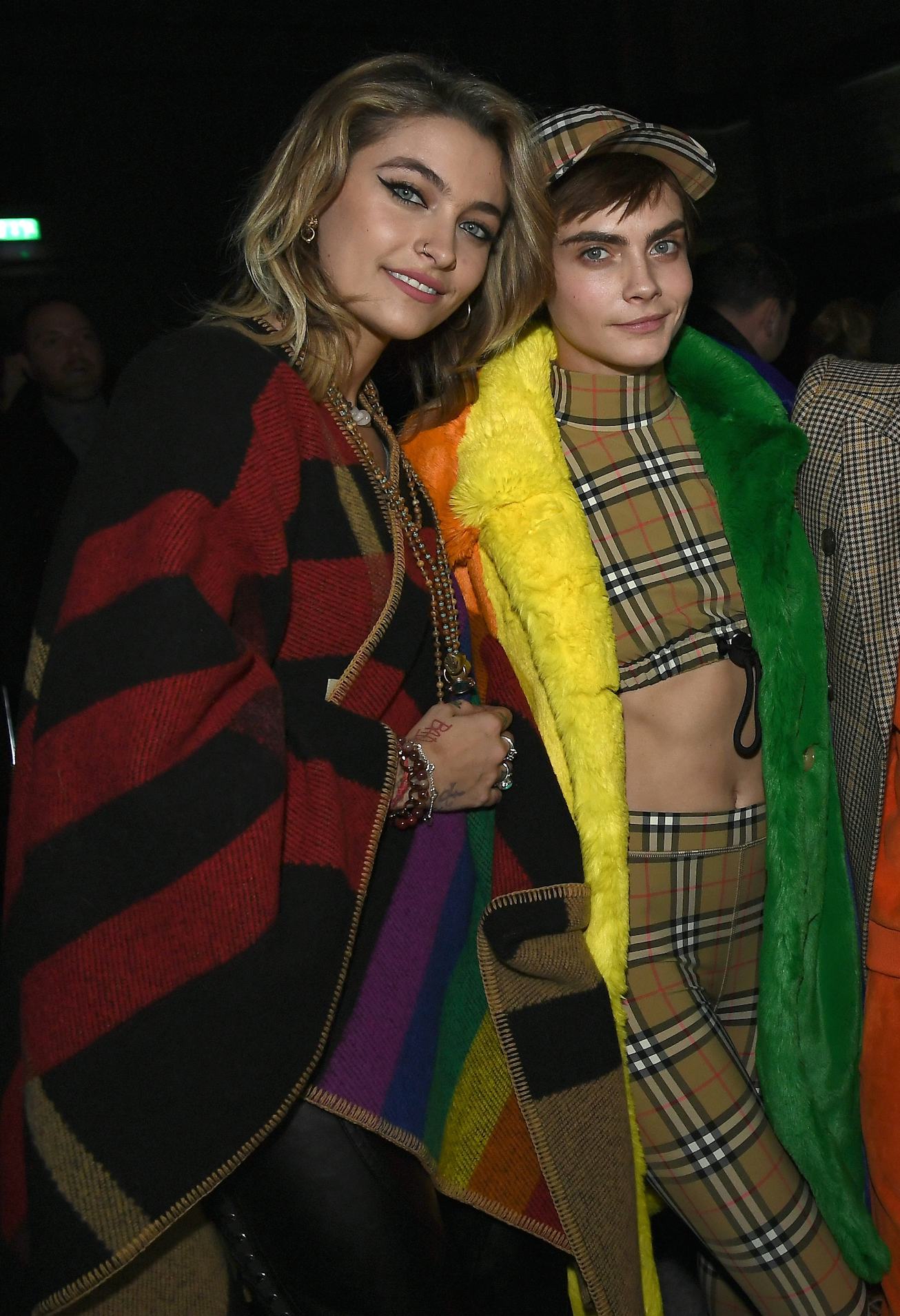 Paris Jackson and Cara Delevingne wearing Burberry at the Burberry February 2018 show during London ...