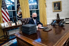 WASHINGTON, DC - JANUARY 20: President Joe R. Biden speaks and signs executive orders in the Oval Of...