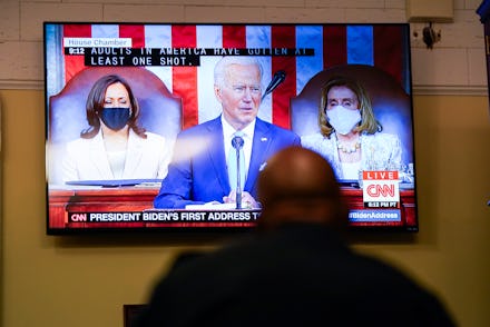 WASHINGTON, DC - APRIL 28: A screen shows President Joe Bidens address of the Joint Session of the 1...