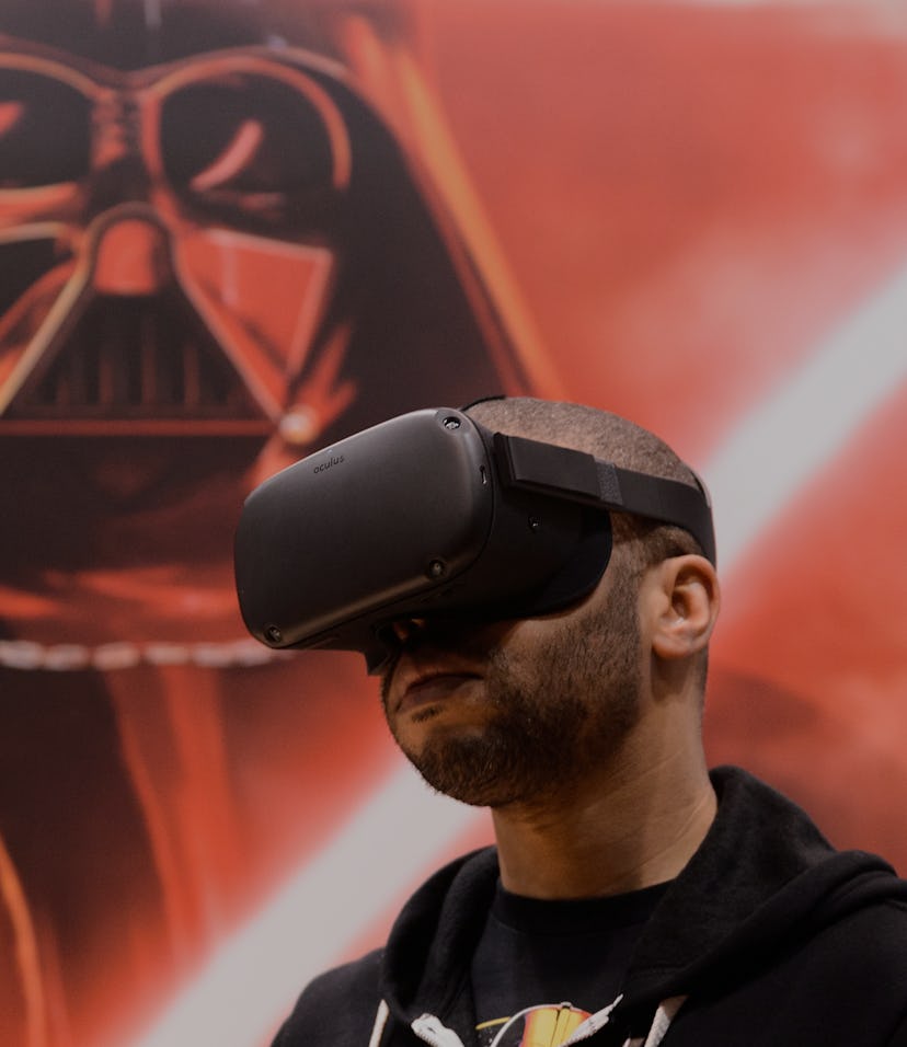 CHICAGO, IL - APRIL 15:  An attendee plays the 'Vader Immortal: A Star Wars VR Series" experience on...