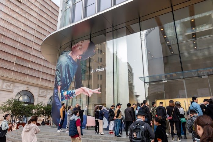 Citizens wait outside the entrance of an Apple store on East Nanjing Road to purchase AirPods Pro on...