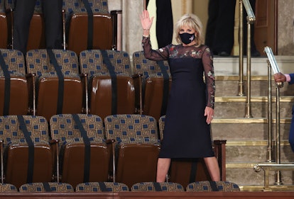 US first lady Jill Biden waves as she arrives for US President Joe Biden's address to a socially dis...