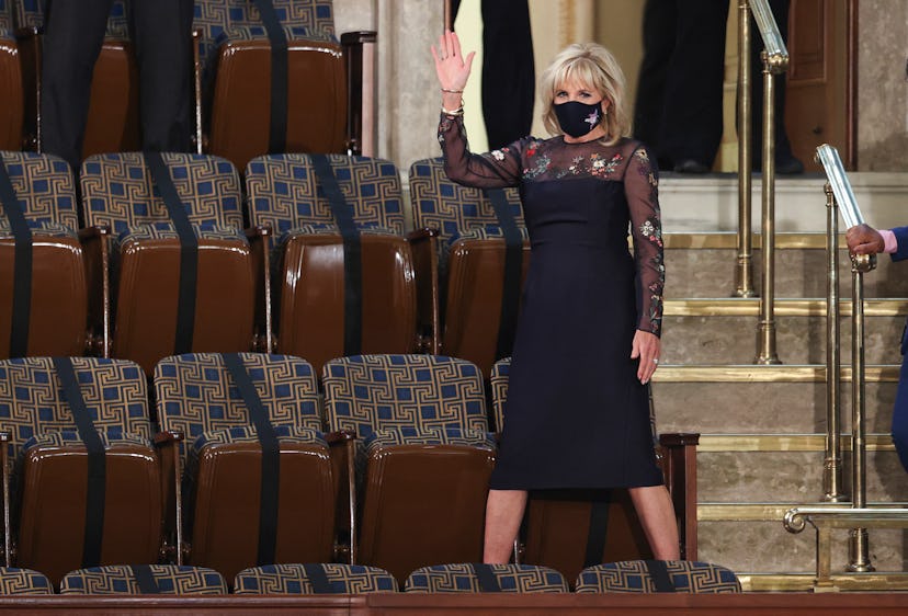 US first lady Jill Biden waves as she arrives for US President Joe Biden's address to a socially dis...