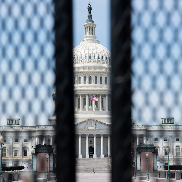 A tall security fence surrounds the US Capitol ahead of US President Joe Bidens address to a joint s...