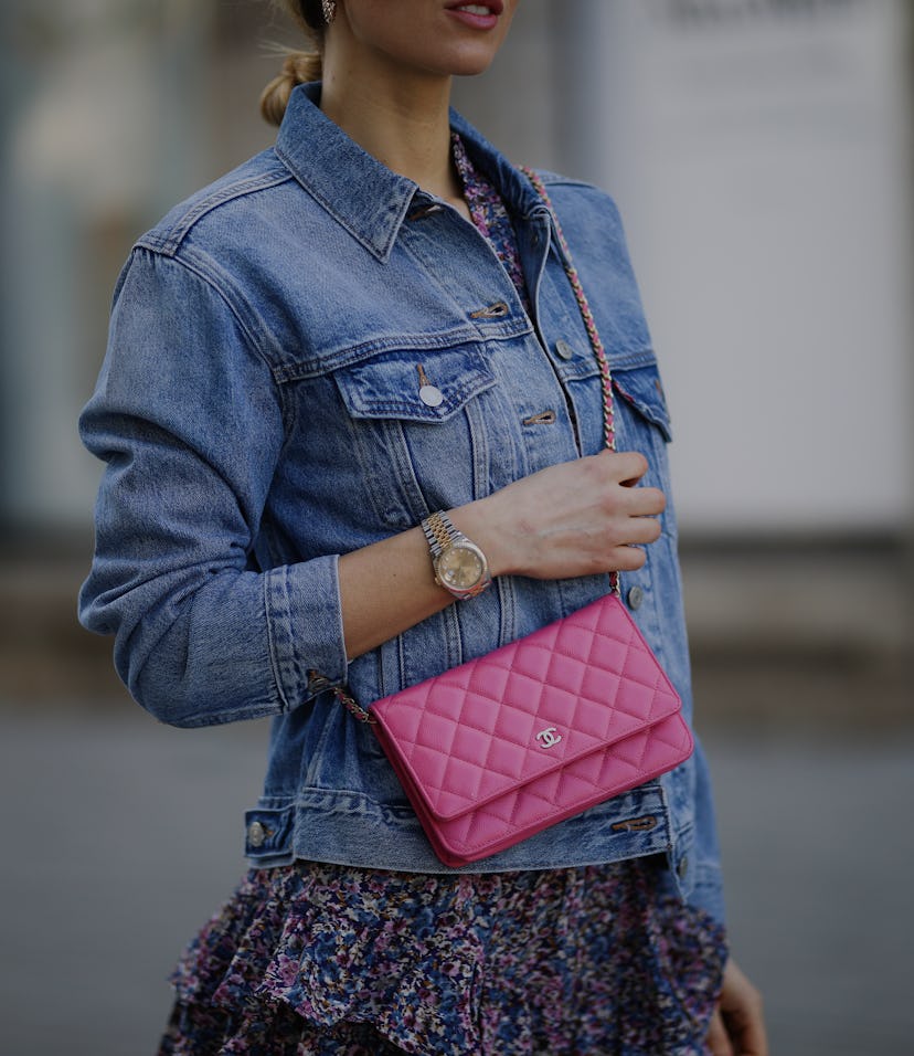 DUSSELDORF, GERMANY - MARCH 24: Scarlett Gartmann wearing Neo Noir flower mini dress, pink Chanel Wa...