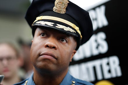 Minneapolis Police Chief Medaria Arradondo left, listened as north side community members held a pro...