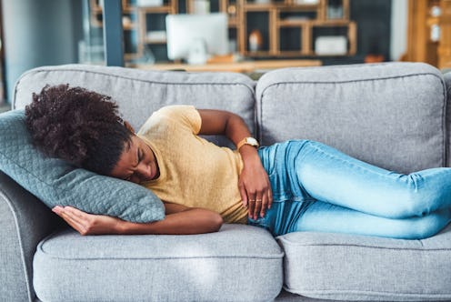 A woman feeling nauseous as a result of anxiety.