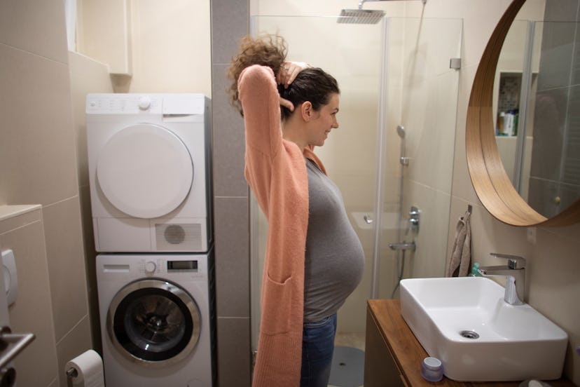 pregnant woman in bathroom