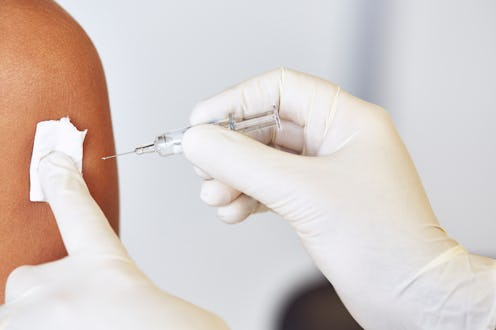 A woman receives a COVID vaccine. Doctors explain whether you can drink after getting your COVID vac...