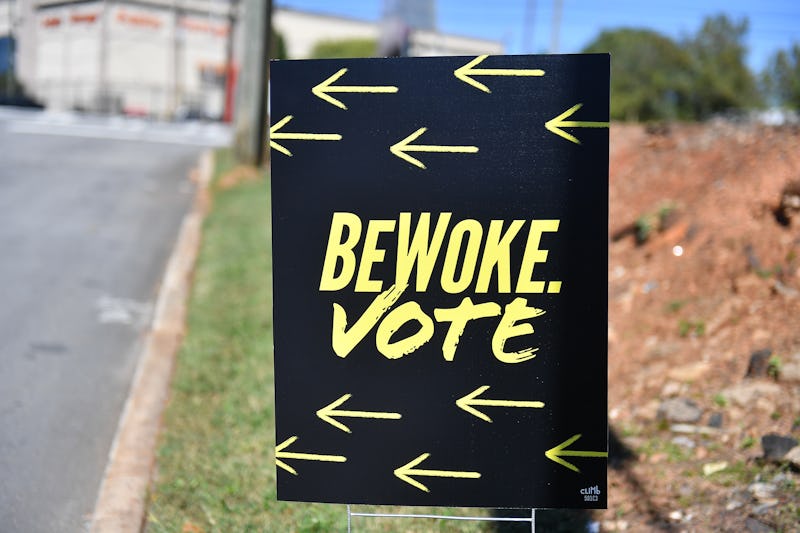 ATLANTA, GEORGIA - OCTOBER 17: A sign reads "Be Woke. Vote." The meaning of woke slang term has evo...