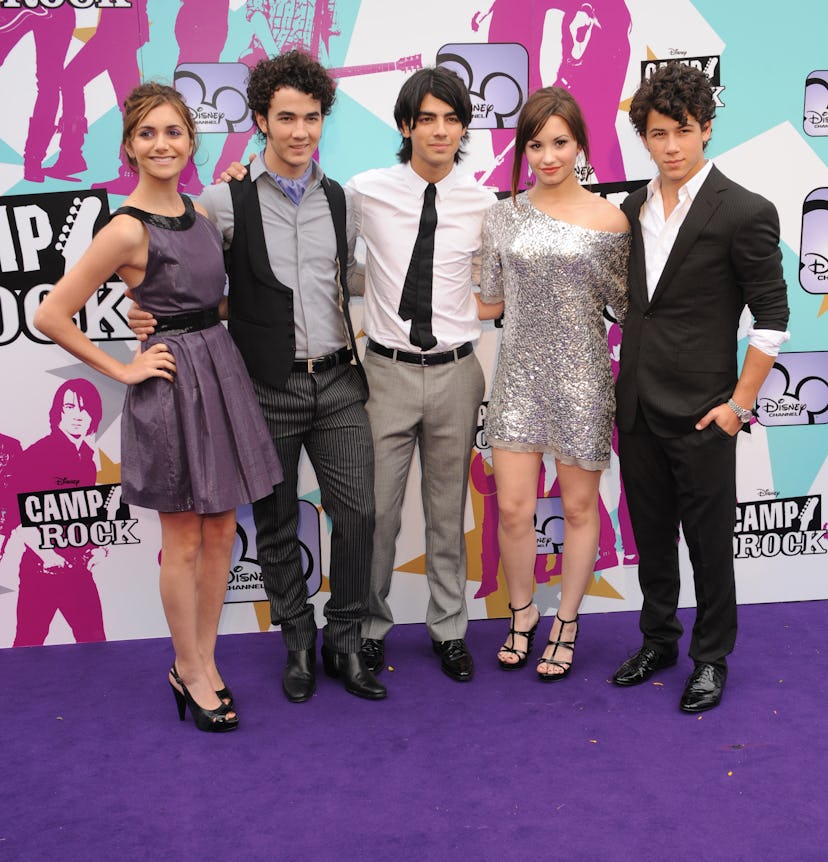 (L-R) Alyson Stoner, Kevin Jonas, Joe Jonas, Nick Jonas and Demi Lovato attend the premiere of "Camp...