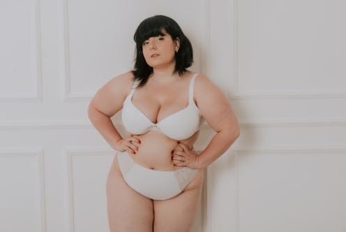 Pretty oversize woman posing in studio - Beautiful girl accepting her body imperfection, beauty shot...