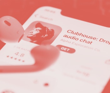 Clubhouse Drop-in audio chat app logo on the App Store is seen displayed on a phone screen in this i...
