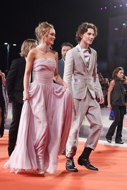 VENICE, ITALY - SEPTEMBER 02: Lily-Rose Depp and Timothee Chalamet attend "The King" red carpet duri...
