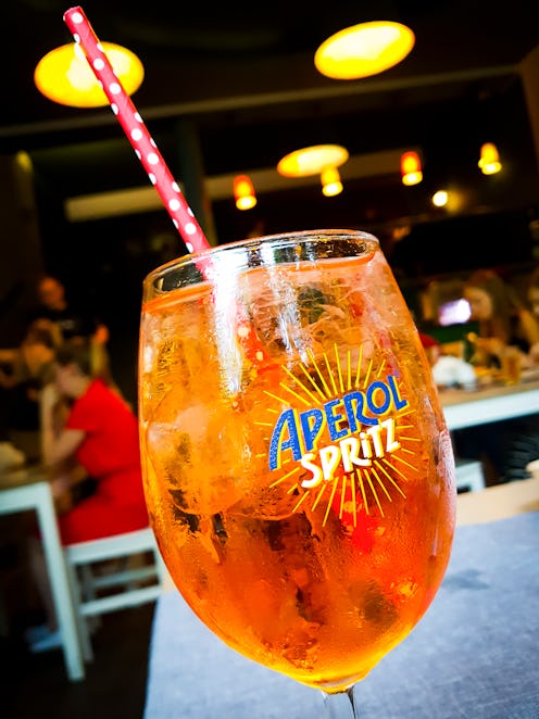 Aperol Spritz drink is served indoors a restaurant in Krakow, Poland, on 8 August 2019. (Photo by B...