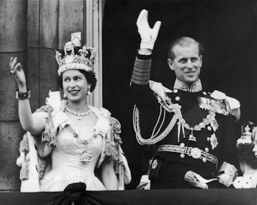 Queen Elizabeth II and the Duke of Edinburgh wave at the crowds from the balcony at Buckingham Palac...