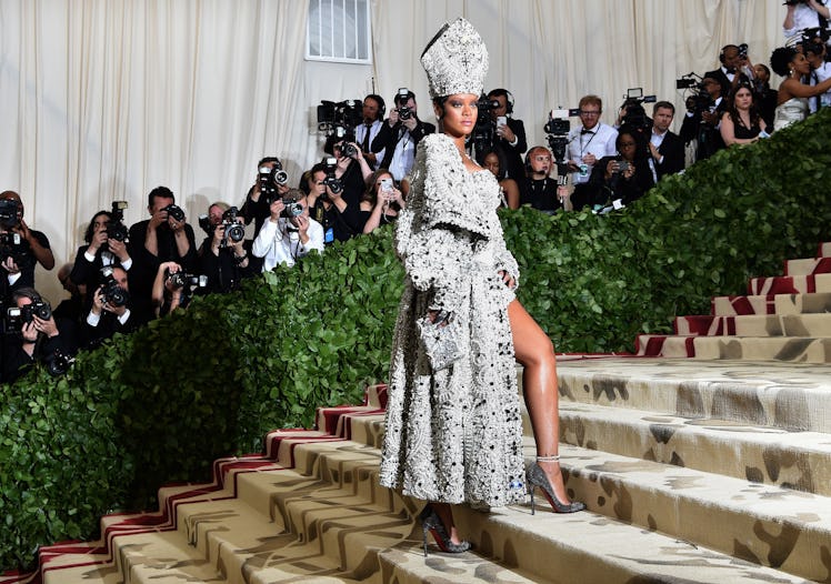 TOPSHOT - Rihanna arrives for the 2018 Met Gala on May 7, 2018, at the Metropolitan Museum of Art in...