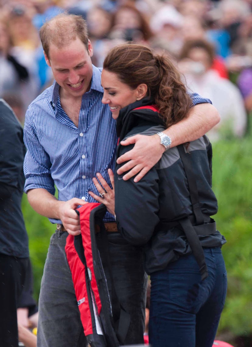 Prince William hugs Kate Middleton in Canada.