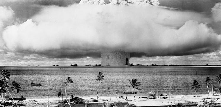This view from the shore at Bikini shows the explosion of the atomic bomb in underwater test of July...