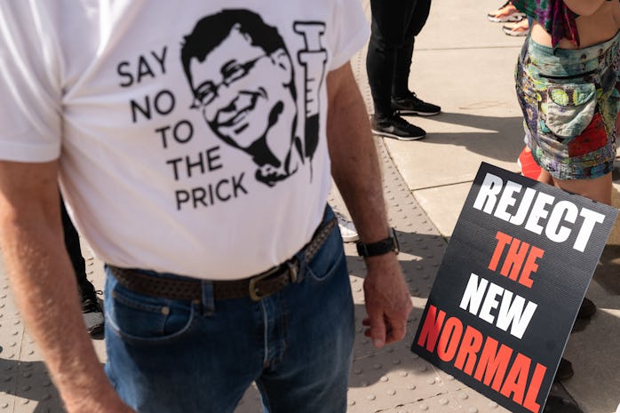 ATLANTA, GA - MARCH 13: A man wears a shirt referencing Bill Gates and the COVID-19 vaccine at a pro...