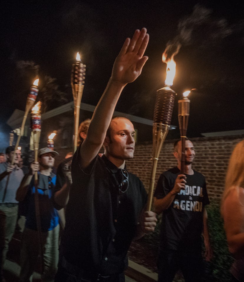 CHARLOTTESVILLE,VA-AUG11:Chanting White lives matter! You will not replace us! and Jews will not rep...
