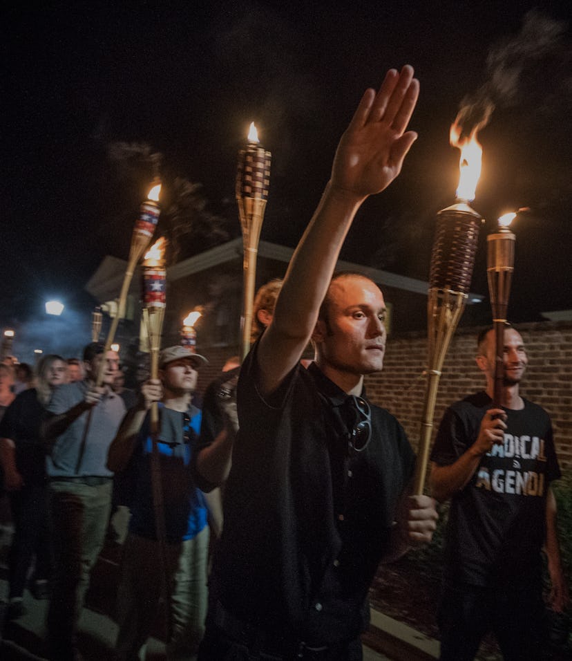 CHARLOTTESVILLE,VA-AUG11:Chanting White lives matter! You will not replace us! and Jews will not rep...