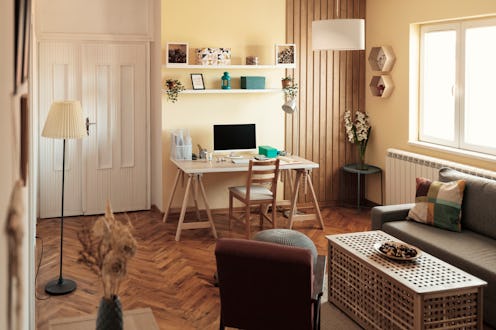Working Space With Computer Desk and Accessories in Cozy Apartment. Home Office Design