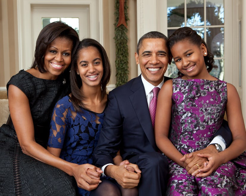 In this handout provided by the White House, (L - R) First Lady Michelle Obama, Malia Obama, U.S. Pr...