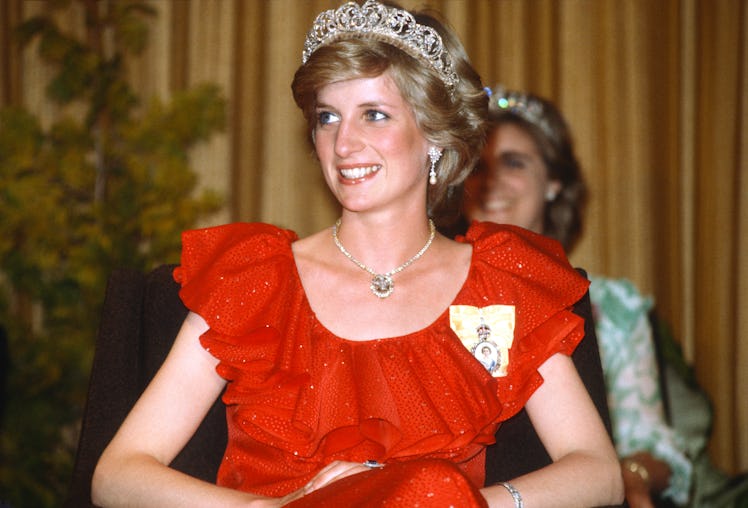 HOBART, AUSTRALIA - MARCH 30: Diana, Princess of Wales, wearing a red dress designed by Bruce Oldfie...