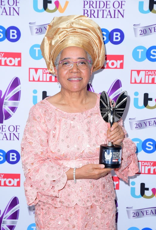 Dame Elizabeth Anionwu with the Lifetime Achievement Award, presented by Janet Jackson, in the press...