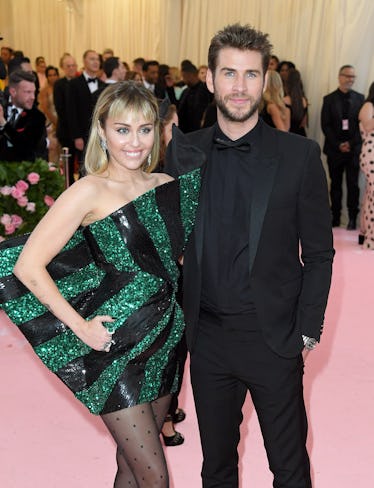 NEW YORK, NEW YORK - MAY 06: Miley Cyrus and Liam Hemsworth arrive for the 2019 Met Gala celebrating...