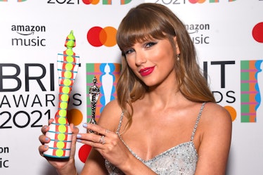 LONDON, ENGLAND - MAY 11: Taylor Swift with the Global Icon award during The BRIT Awards 2021 at The...