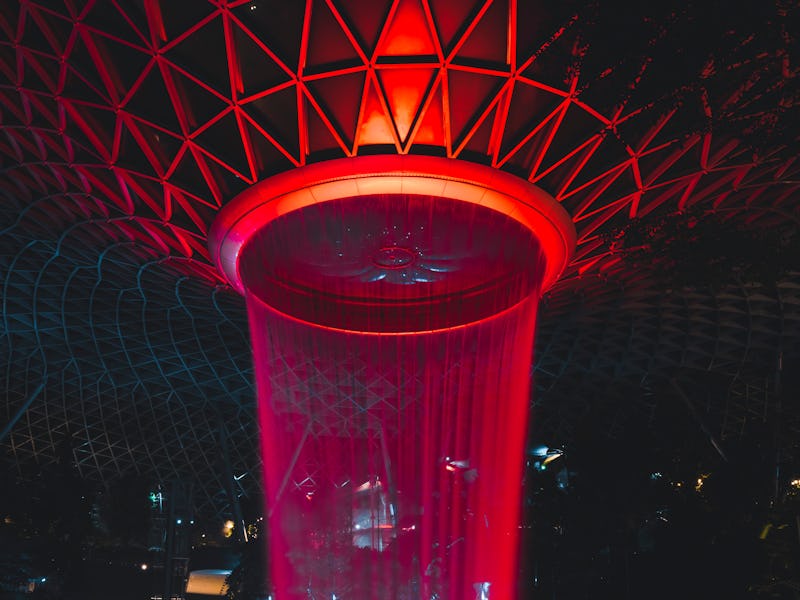 Singapore, September 6, 2020: View at the spectacular red waterfall inside the Changi Airport in Sin...