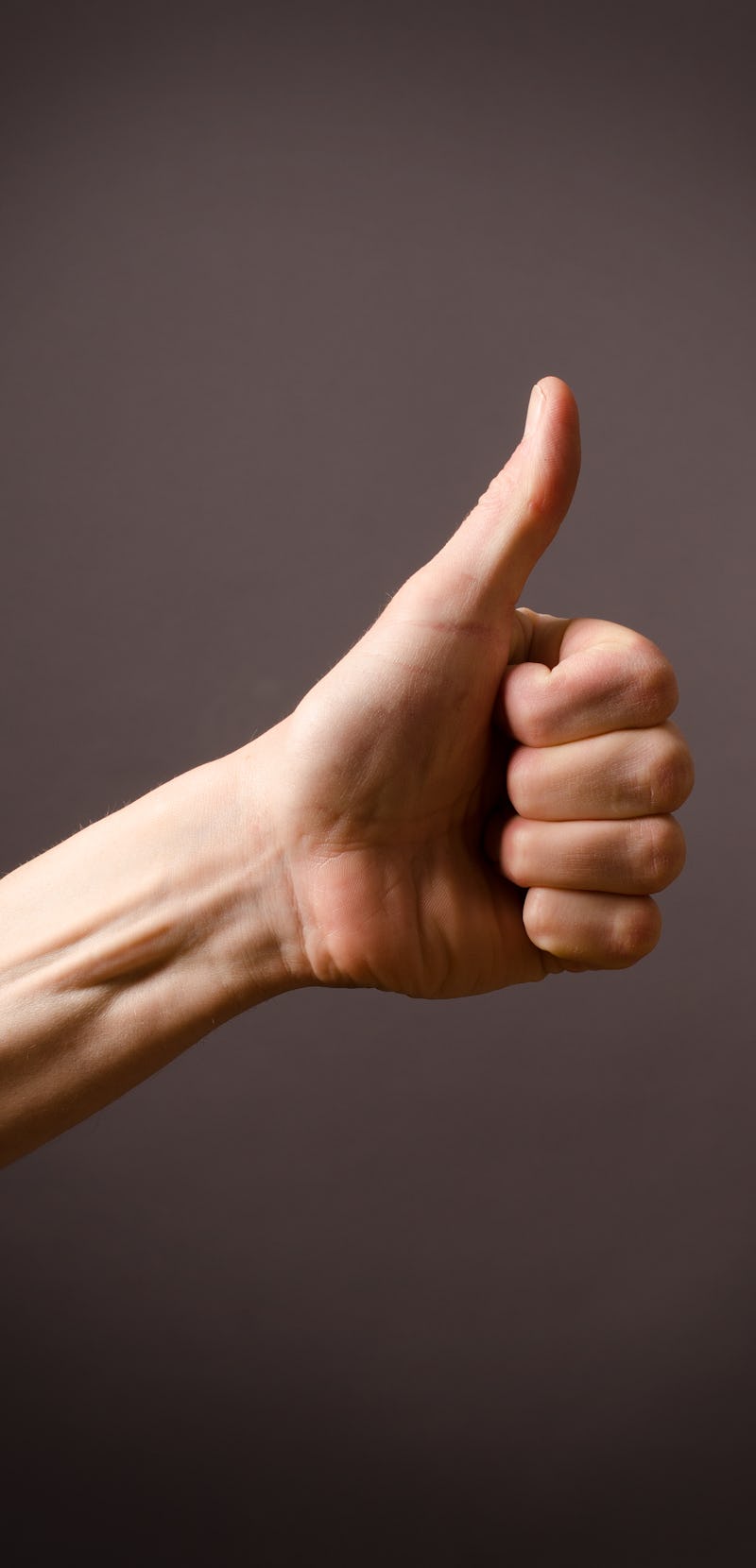 hand giving thumbs up gesture