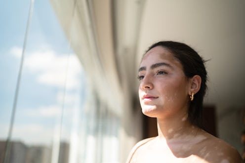 Young woman contemplating at home