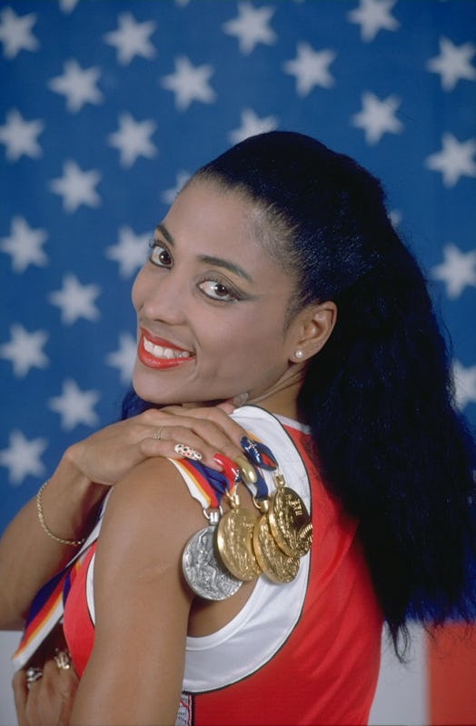 Florence Griffith Joyner posing with her medals at the 1988 Olympic Games