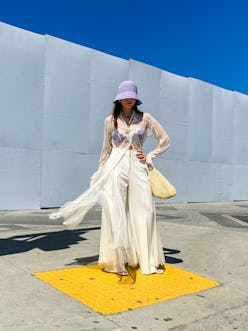 PARIS, FRANCE - MAY 04: Julia Comil wears a White Tulle shirt dress by Selezza London, high waisted ...