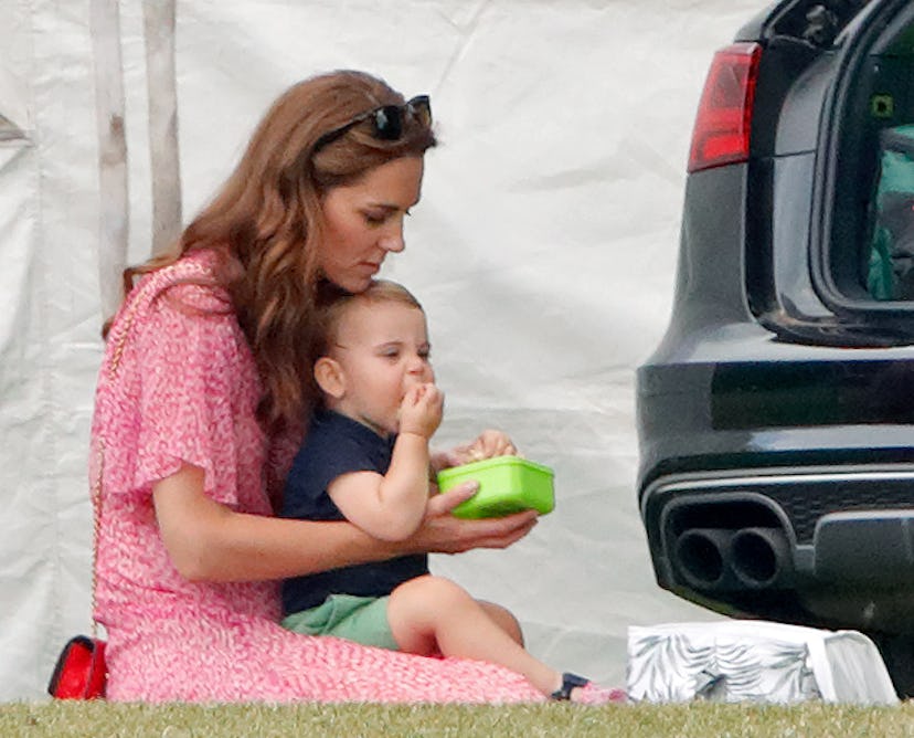 Prince Louis enjoys a light snack.