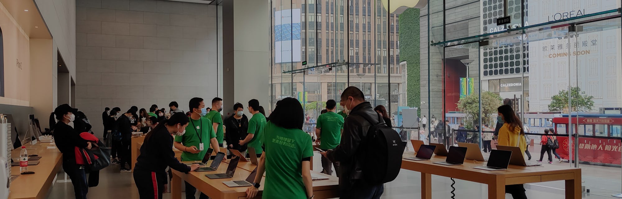 SHANGHAI, CHINA - APRIL 16, 2021 - The Apple store's LOGO lit up with green leaves to mark World Ear...