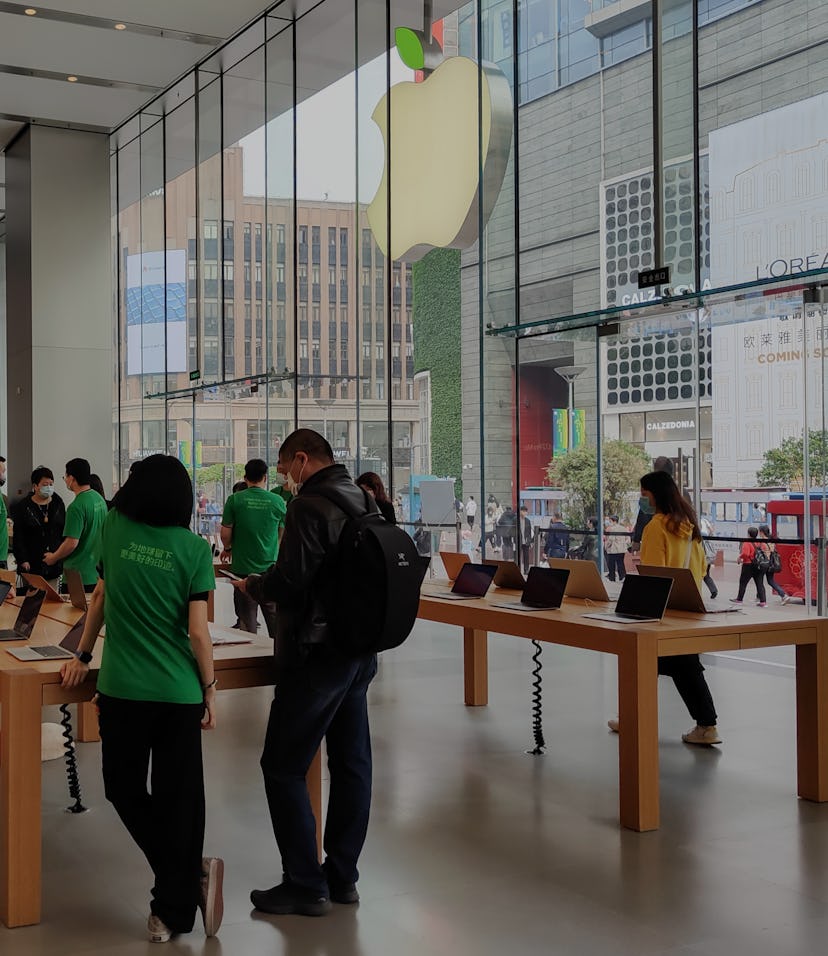 SHANGHAI, CHINA - APRIL 16, 2021 - The Apple store's LOGO lit up with green leaves to mark World Ear...