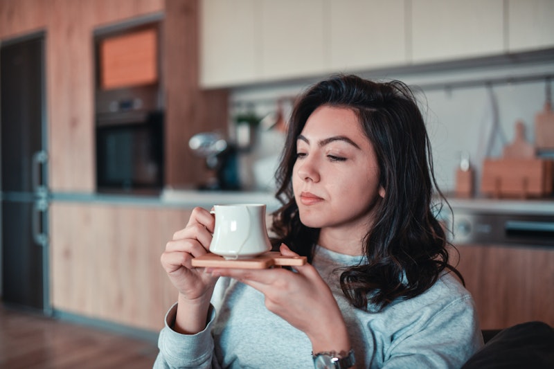 Female Dissatisfied With Coffee In Home Kitchen