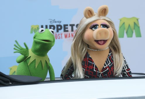 Muppets Miss Piggy and Kermit the Frog arrive to a photocall for the movie "Muppets Most Wanted" at ...