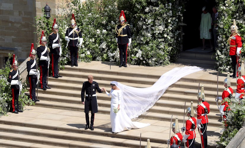 Britain's Prince Harry, Duke of Sussex and his wife Meghan, Duchess of Sussex emerge from the West D...